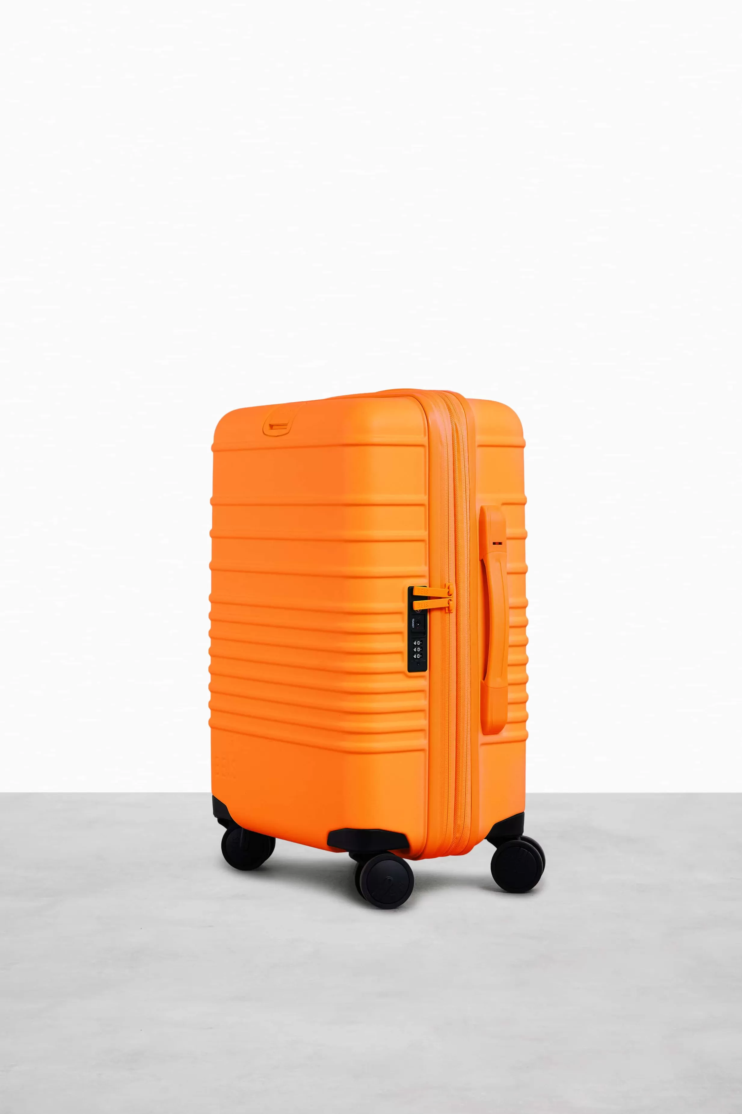 Store The Carry-On Roller In Creamsicle Hard-Sided Luggage