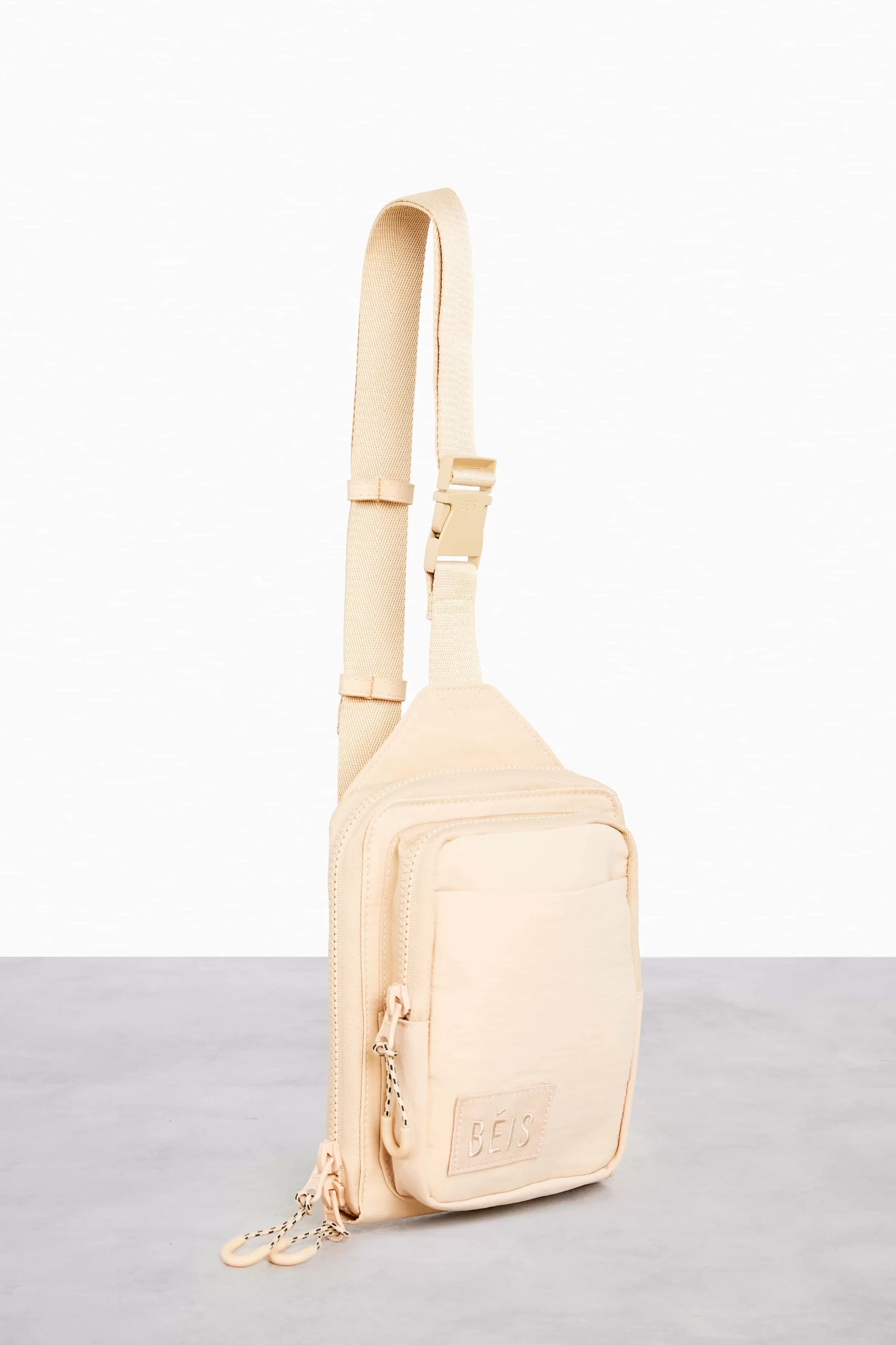 Shop The Sport Sling In Beige Active Bags