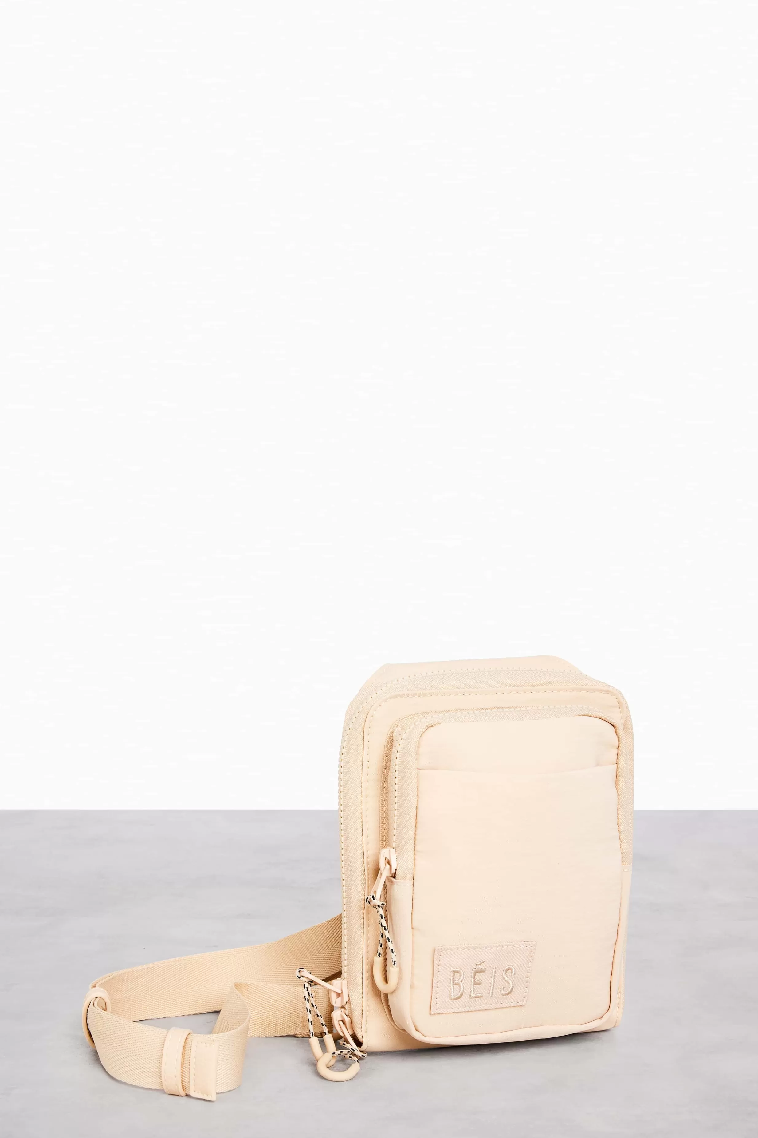 Shop The Sport Sling In Beige Active Bags