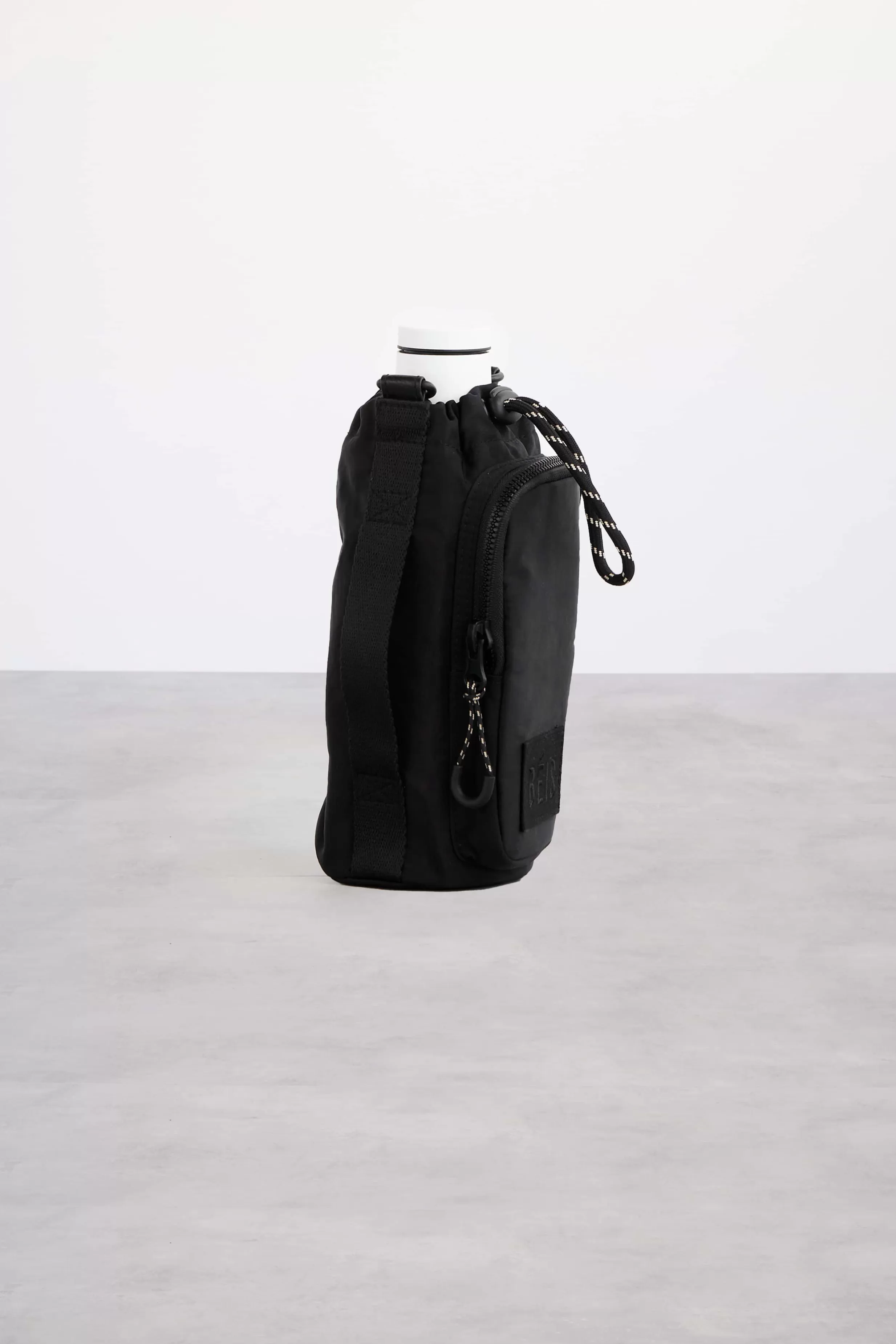 Fashion The Water Bottle Sling In Black Active Bags